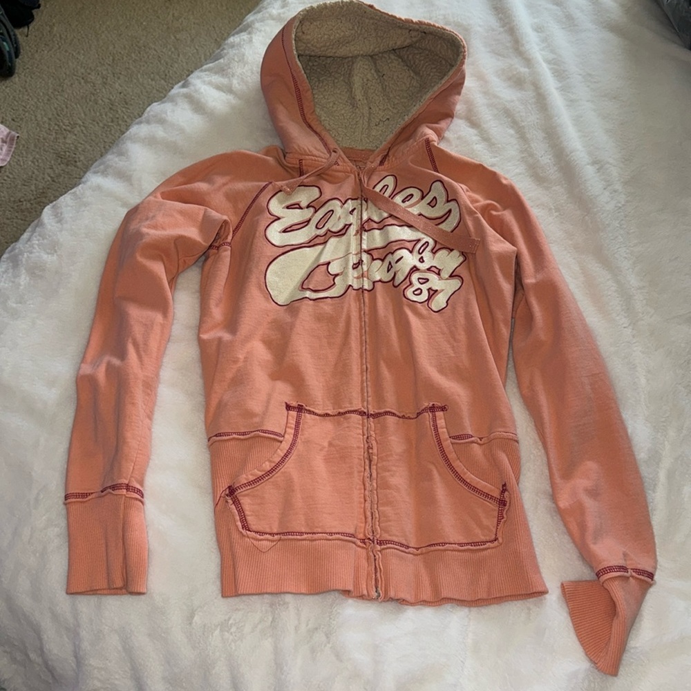 Vanity, peachy, pink Sherpa sweater with hood says eagle rugby, 87 medium